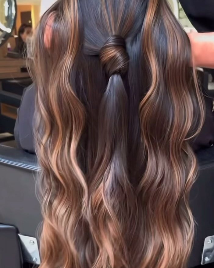 Half-up style with layered balayage waves